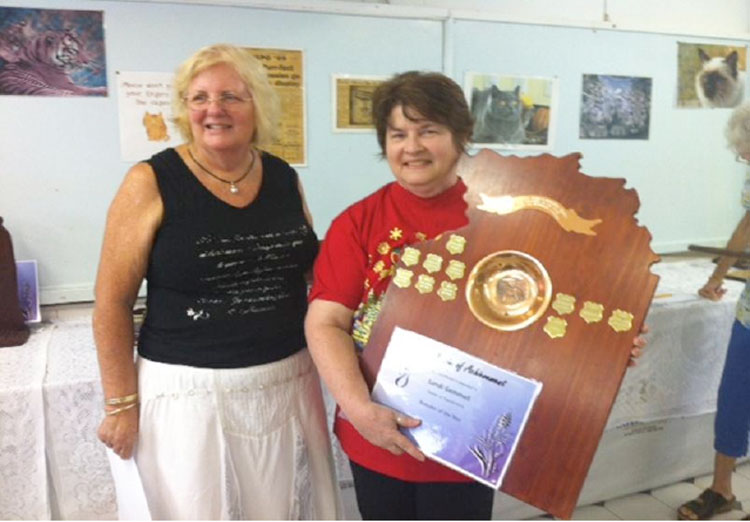Sandi Gemmell receives the Breeder of the Year Trophy from CANT (Inc.) President Heather Havens.